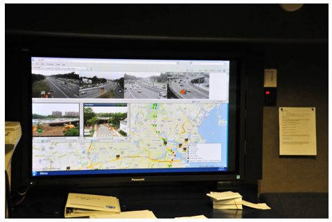 A large video screen depicting teh RTTM traffic map and a series of video feeds from traffic cameras.