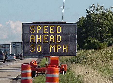 Changeable message sign displaying "Speed Ahead 20 MPH"