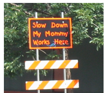 Slow Down My Mommy Works Here sign.