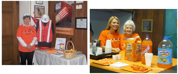 Staff at welcome centers manning informational displays and offering orange colored refreshments.
