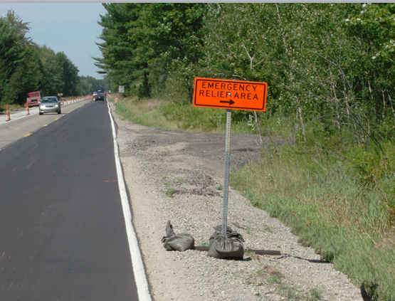 Temporary sign advising drivers that they are approaching a temporary emergency pulloff location.
