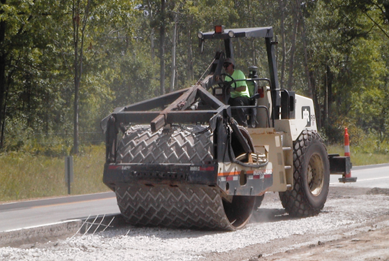 A roller-compactor vehicle.