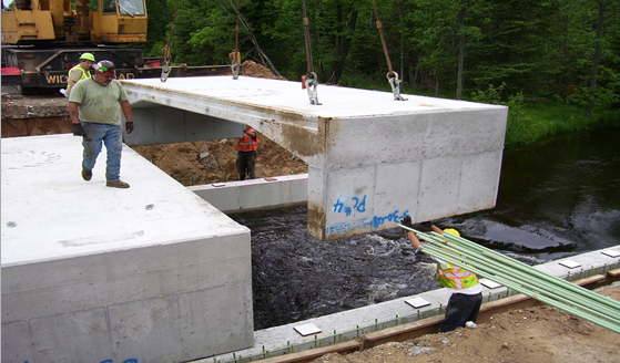 Closeup of Hy-Span pre-cast bridge as it is being installed.