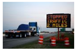 Dynamic message sign displaying 'Stopped Traffic 2 Miles'