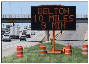 Dynamic message sign displaying 'Belton 10 Miles 9 Minutes'