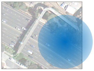 An overhead image of 5-lane restricted access highway with a circular highlighted area focused on the right-hand lane.