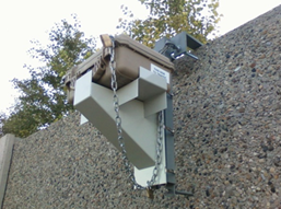 Picture of a bluetooth roadside data collection device mounted on a road-side wall.