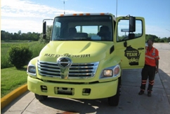 Photo of a Freeway Service Team truck and driver.