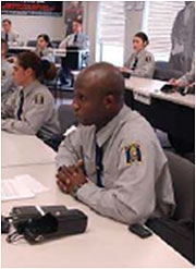 Photo of uniformed police officers in a training class.