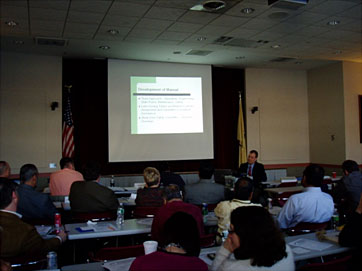 Photo of a training class viewing a PowerPoint presentation.