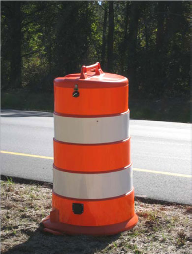 The figure shows a picture of a portable traffic data collection device drum at the North Carolina pilot test location.