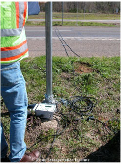 A photograph shows two sensor lines for traffic count recording stretched across a highway.