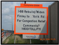 A photo shows an information sign at the side of a highway. The sign briefly describes the project and provides a toll free number for comments.