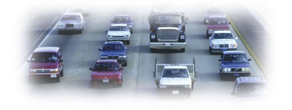 Photograph of traffic in multiple lanes facing toward the camera.