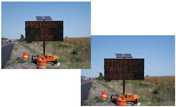 A message board flashing two messages, the first being 'prepare to stop' and the second being 'traffic stopped ahead.'