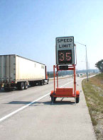 photo of portable message board showing speed of approaching traffic as 35 mph