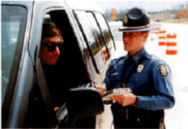 photo of police officer ticketing a driver